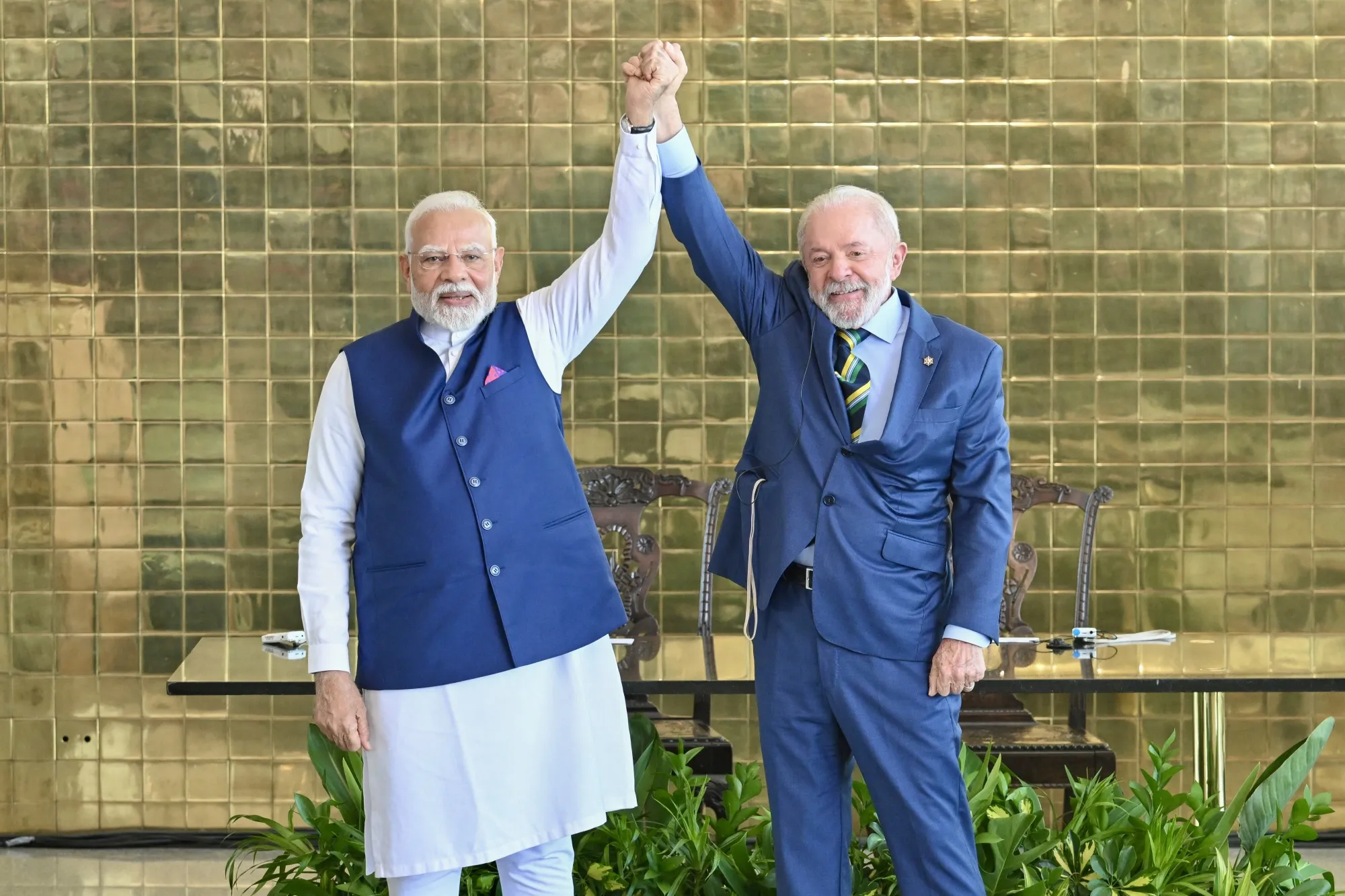 India’s Prime Minister Narendra Modi, left, and Brazil’s President Luiz Inacio Lula da Silva hold hands after a press statement at Alvorada Palace in Brasilia on July 8, 2025.