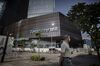 A pedestrian walks past Tencent Holdings Ltd.'s new under construction headquarters in Shenzhen, China,.