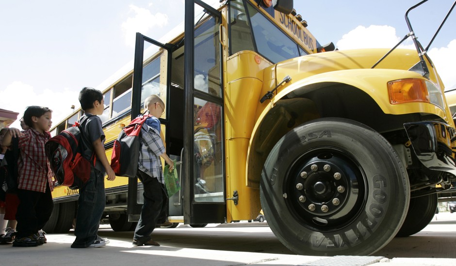 Students board school buses on the first day of classes in San Antonio, Texas.