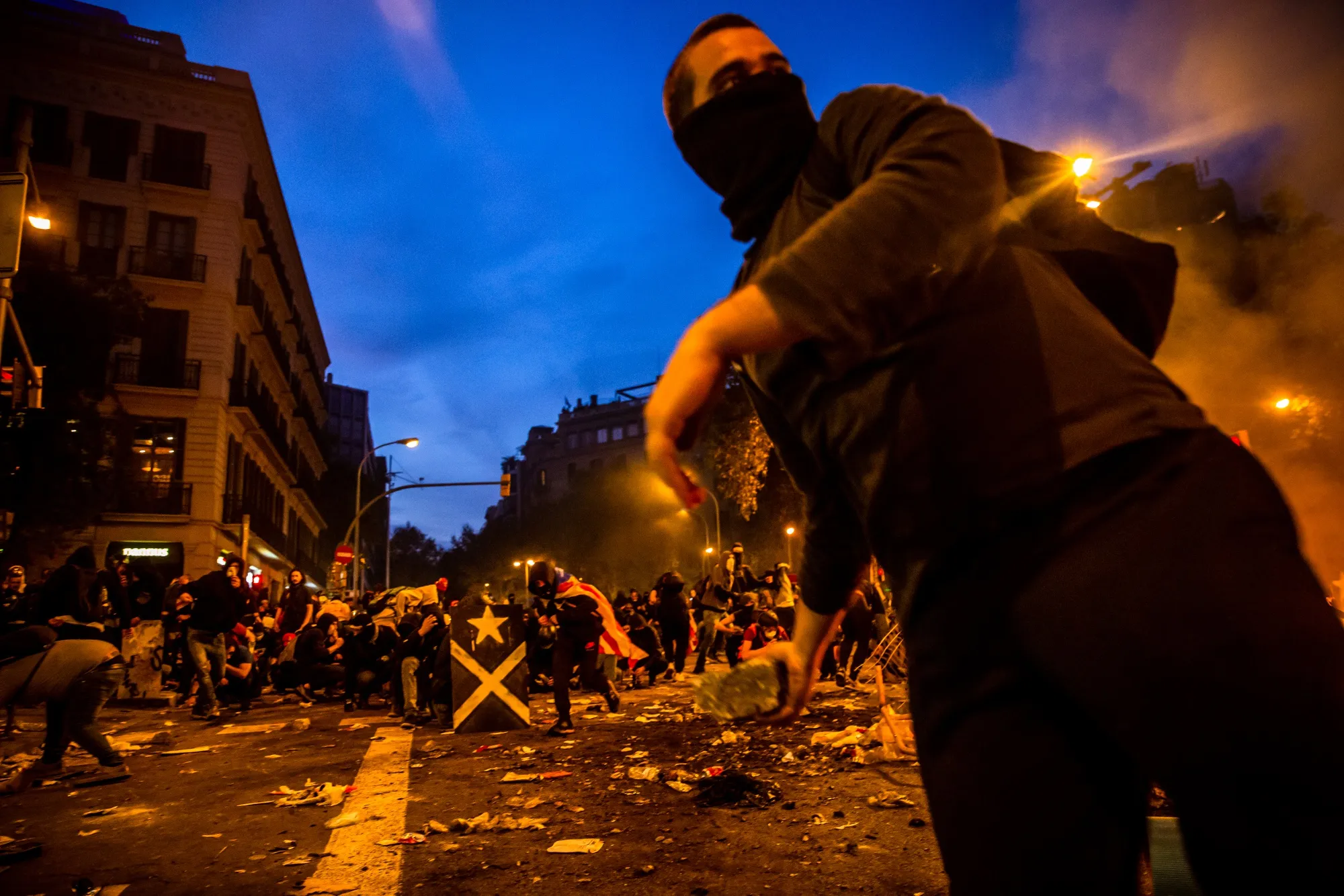 Protesters clash with riot police in Barcelona on Oct. 18.