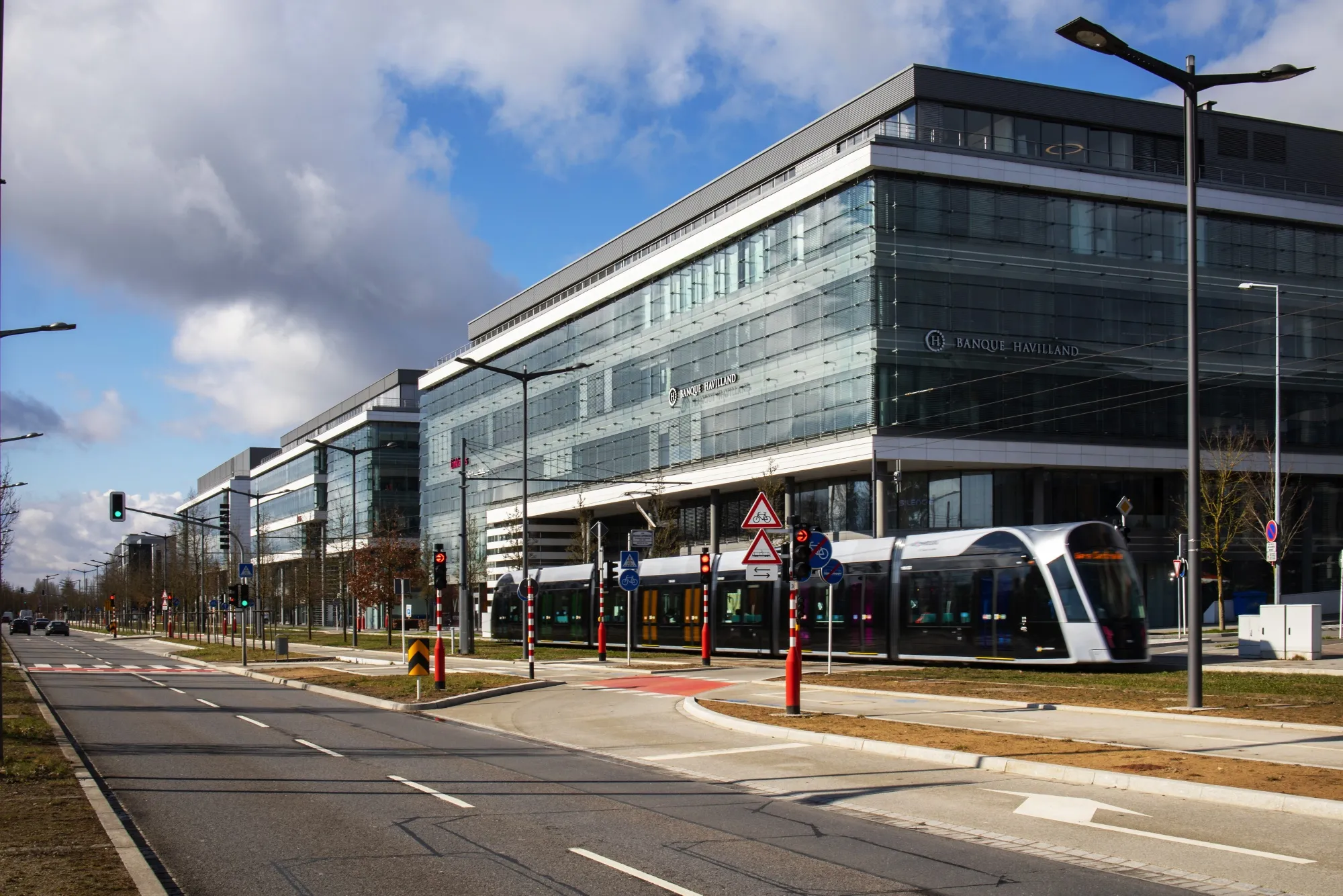 A tram passes the Banque Havilland headquarters in Luxembourg.