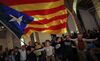 Catalan independence supporters wave a 'estelada' ( pro-independence Catalan flag ) celebrate at the ANC ( Catalan National Assembly ) headquarters.