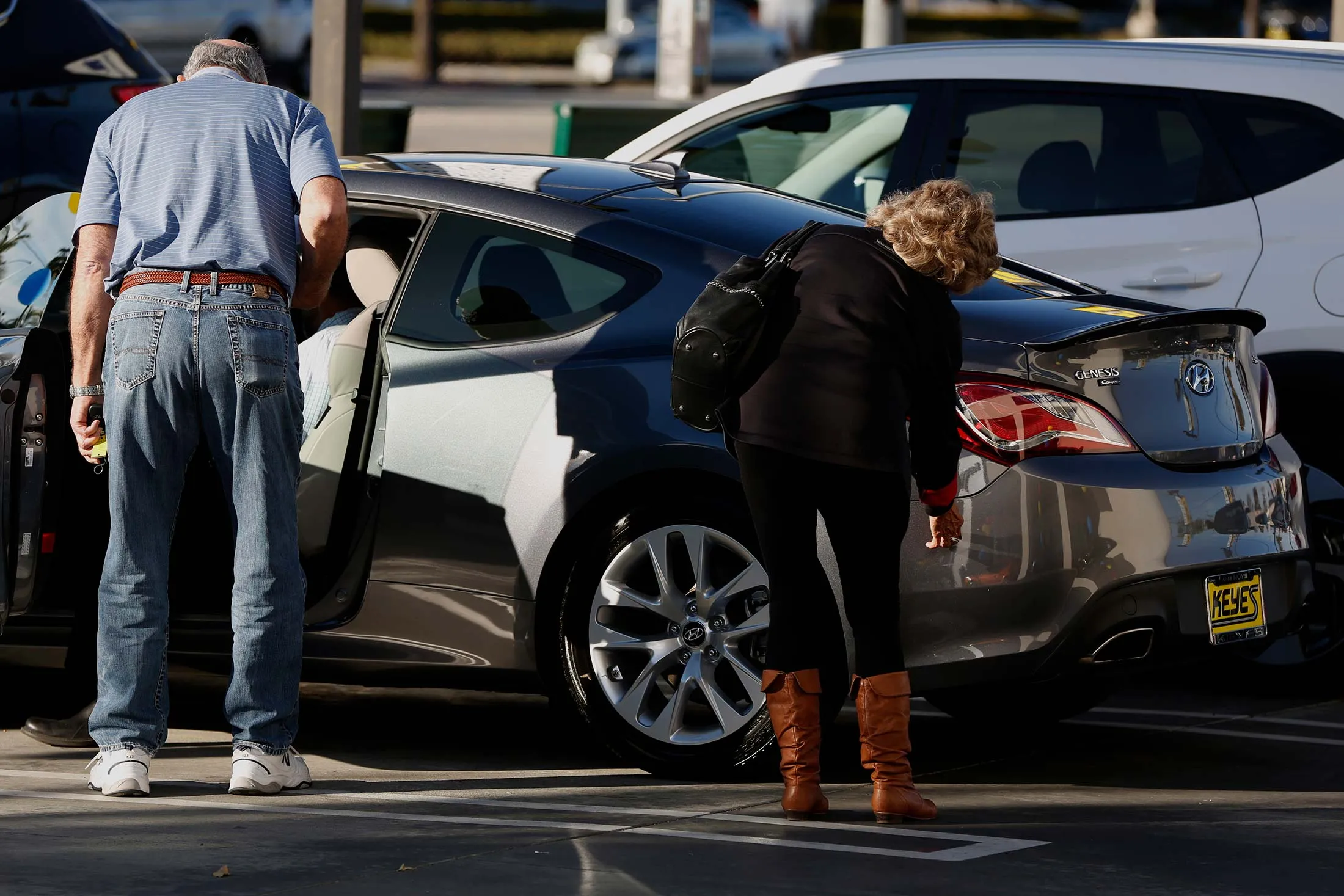 Potential car buyers at a dealership in Los Angeles.
