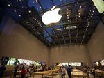 Shoppers look at products at the Upper West Side Apple Inc. store.