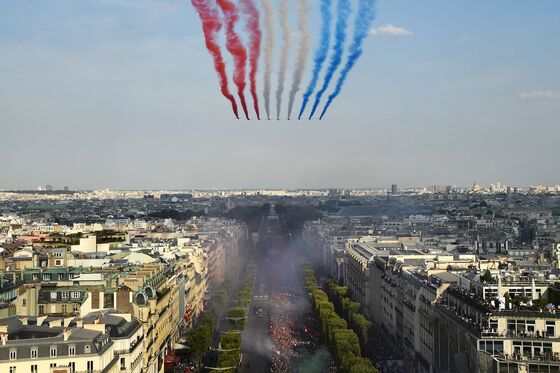Macron, Paris Fans Greet French National Soccer Team Winners