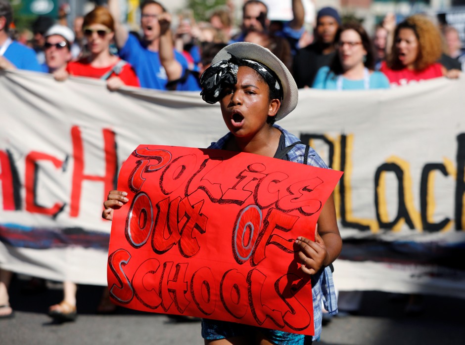 A student marches in a Black Lives Matter rally.