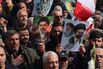 Iranians hold posters bearing the portrait of Mojtaba Khamenei in Enghelab Square, Tehran, on March 11.