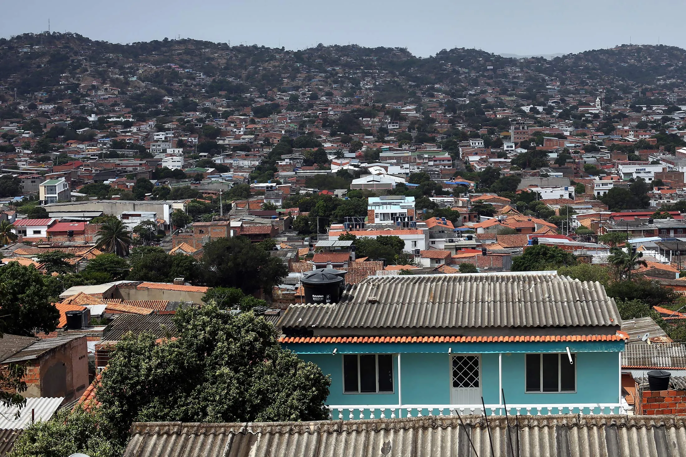 Houses stand in the province of Norte de Santander in Cucuta, Colombia, on Sunday, Feb. 7, 2016.
