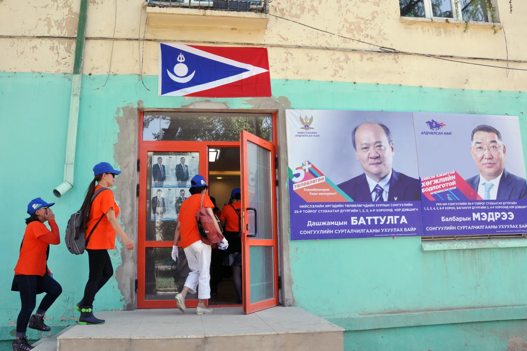Supporters of the Democratic Party of Mongolia walk into a campaign office in Ulaanbaatar on June 27.
