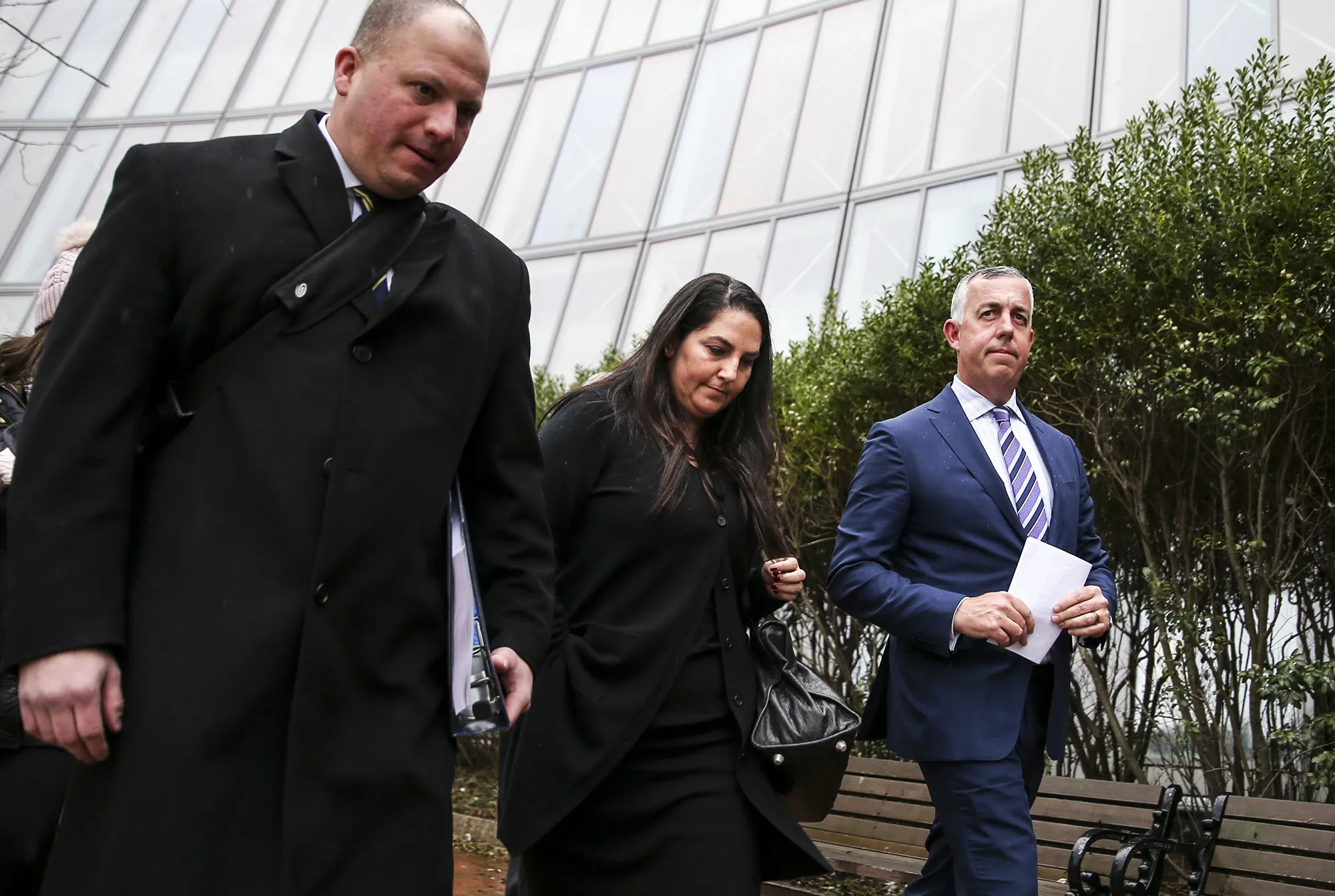 Marjorie Klapper,&nbsp;center, leaves court in Boston on March 29, 2019.