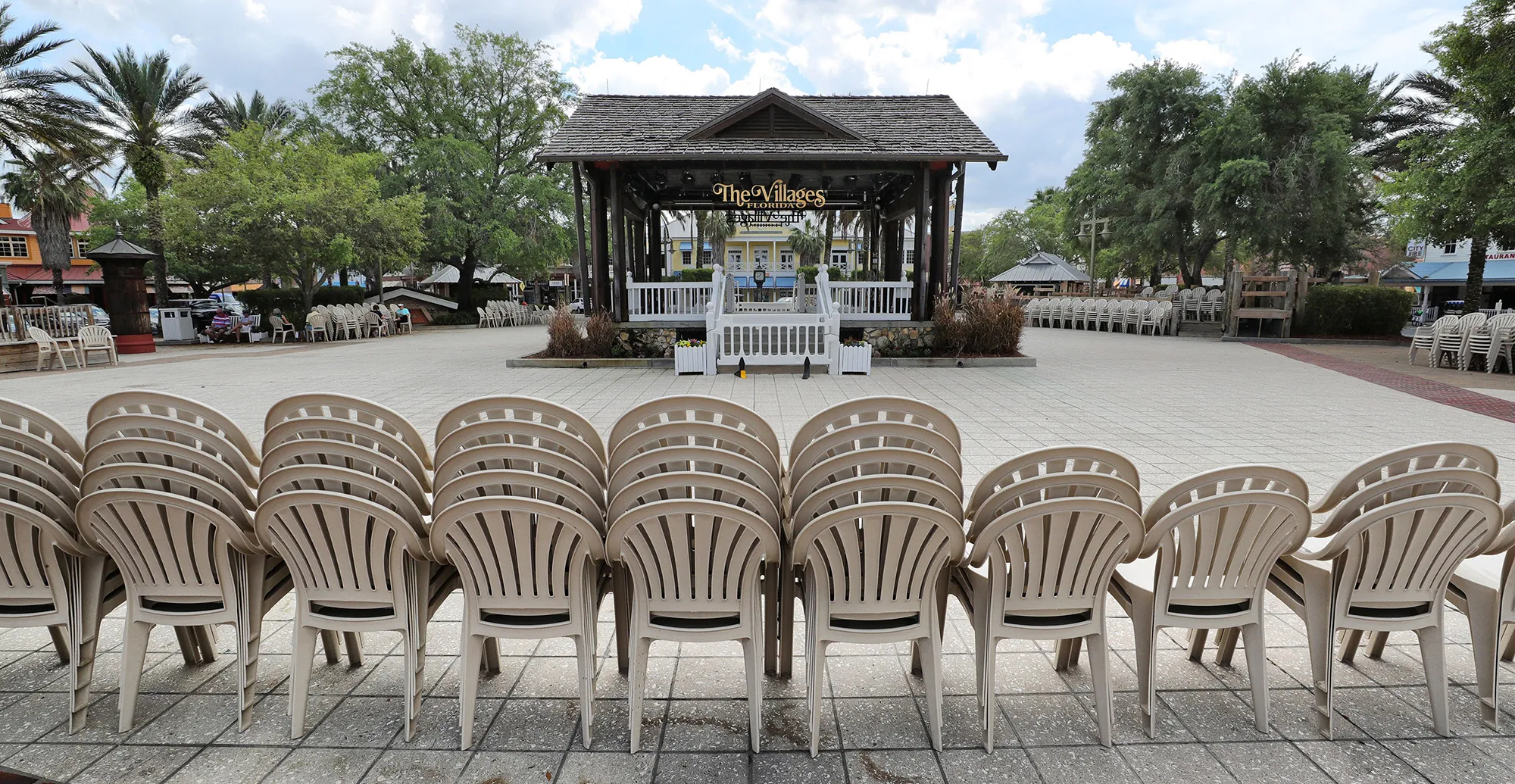 Chairs stacked in a deserted town square in The Villages on&nbsp;March 23.