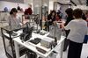 Customers look at bags for sale at the Isetan Shinjuku department store, operated by Isetan Mitsukoshi Holdings Ltd., in Tokyo, Japan.