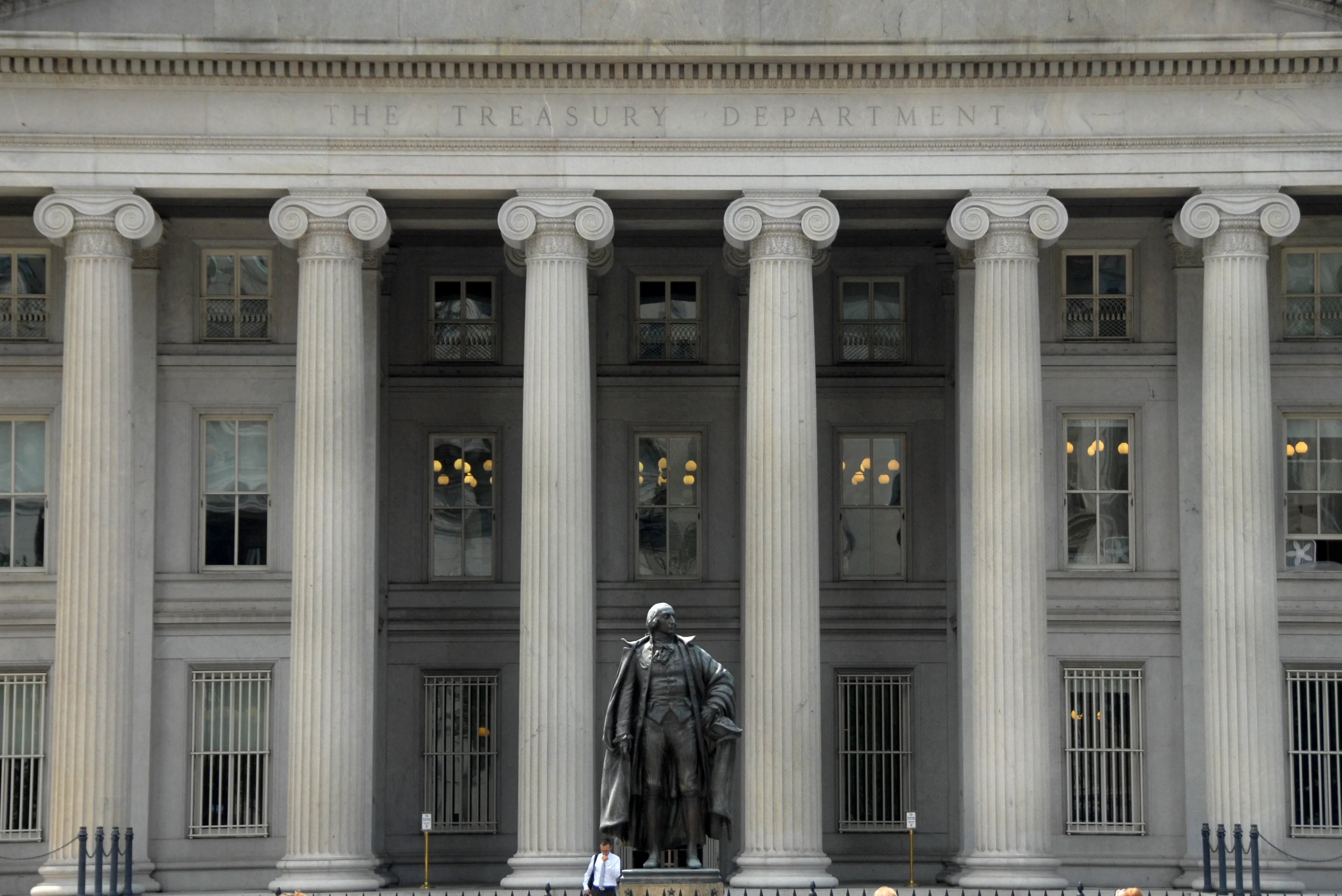 A statue of Albert Gallatin, a long-serving U.S. secretary of the Treasury, stands in front of the U.S. Treasury Building in Washington, D.C.
