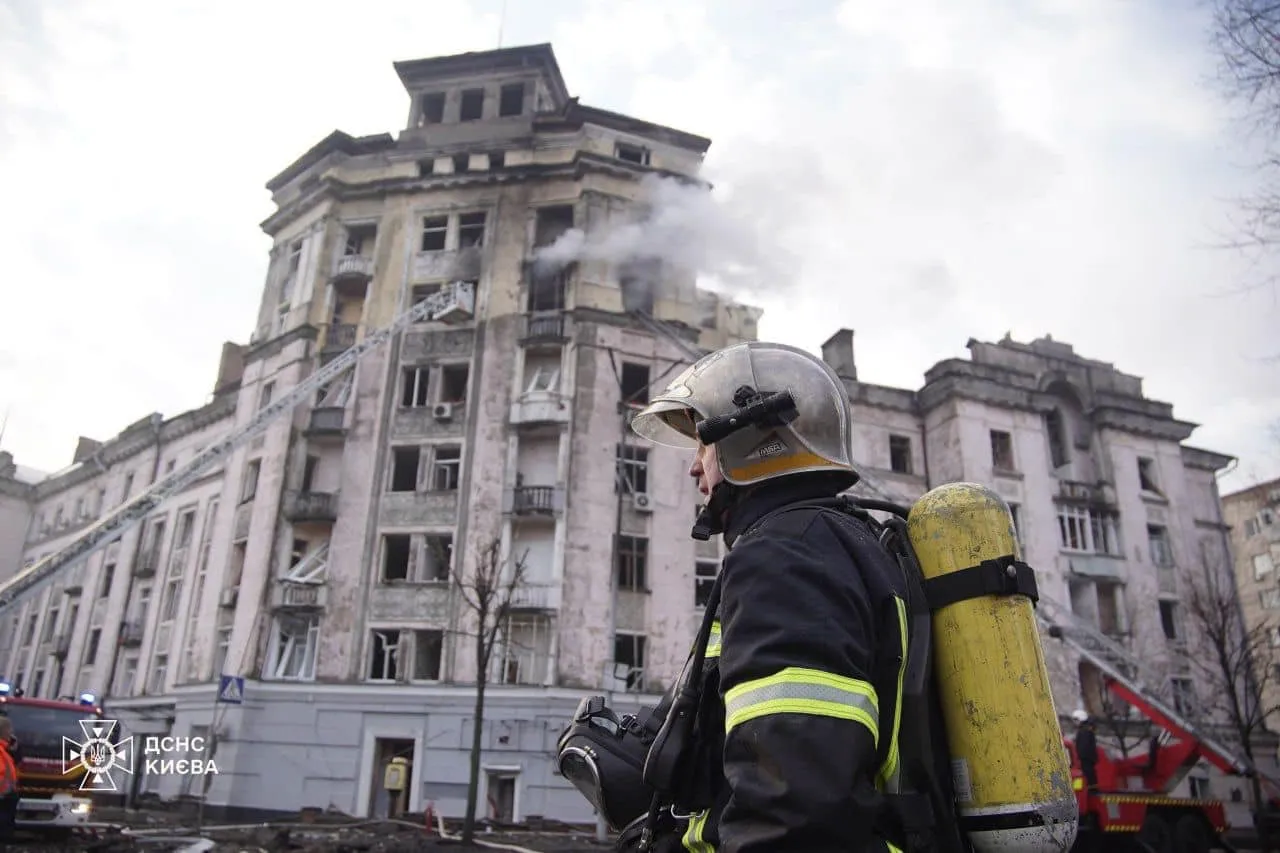 Fire crews at the site of a damaged building in Kyiv on March 21.