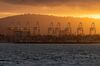 Gantry cranes at sunset at the Port of Long Beach in Long Beach, California.