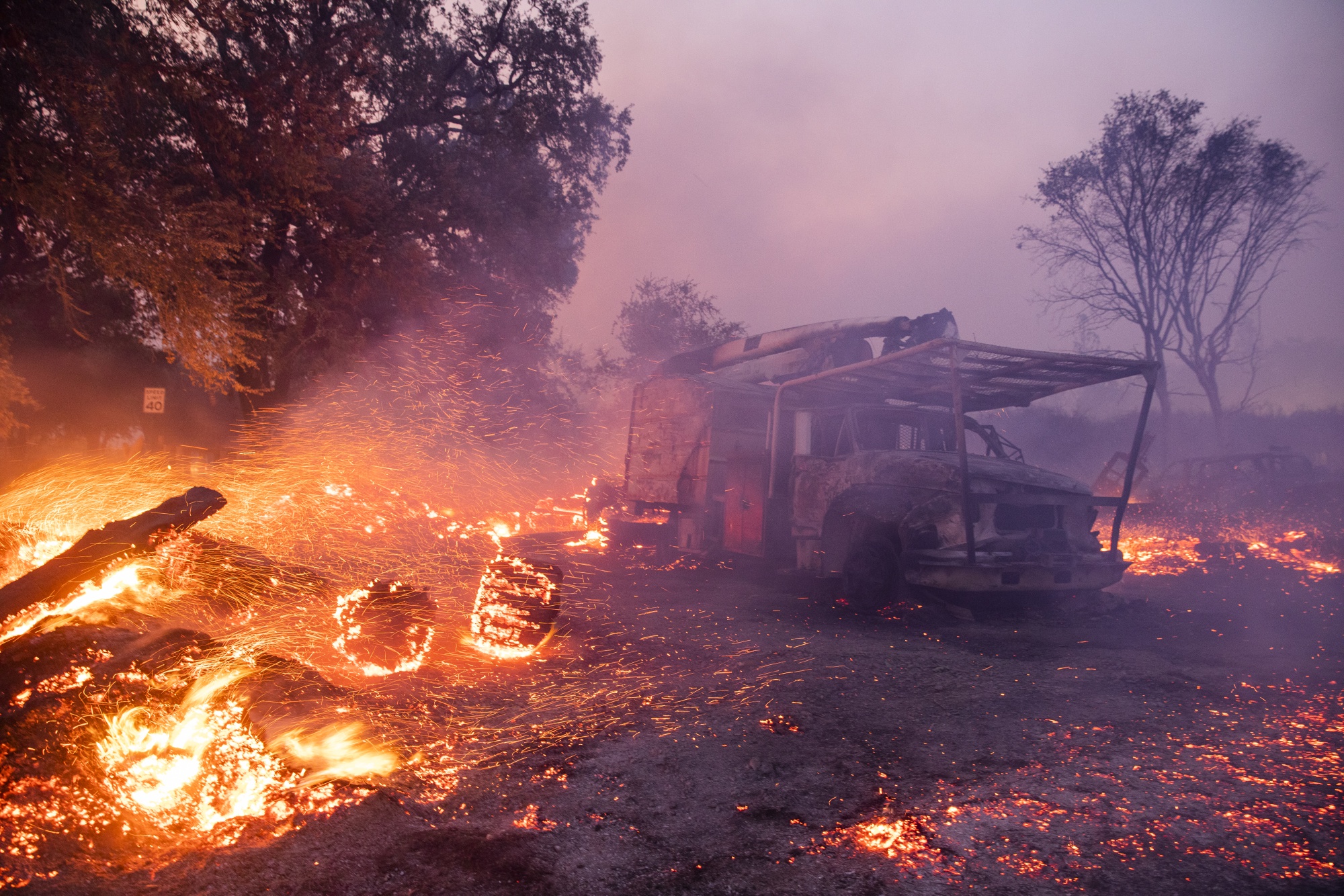 Embers burn on a property during the Kincade fire in Healdsburg, California in&nbsp;2019.&nbsp;