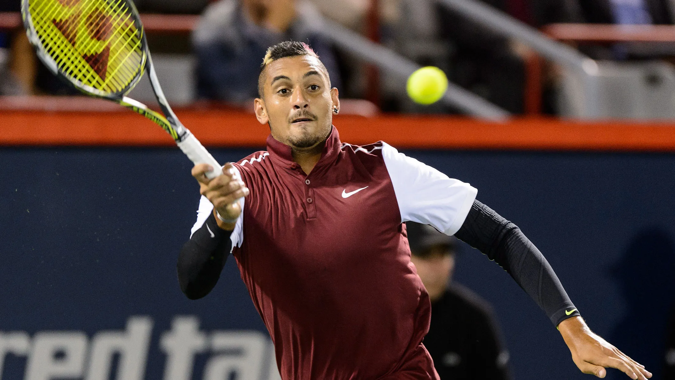 Nick Kyrgios of Australia hits a return against Stan Wawrinka of Switzerland during day three of the Rogers Cup at Uniprix Stadium on August 12, 2015 in Montreal, Quebec, Canada.
