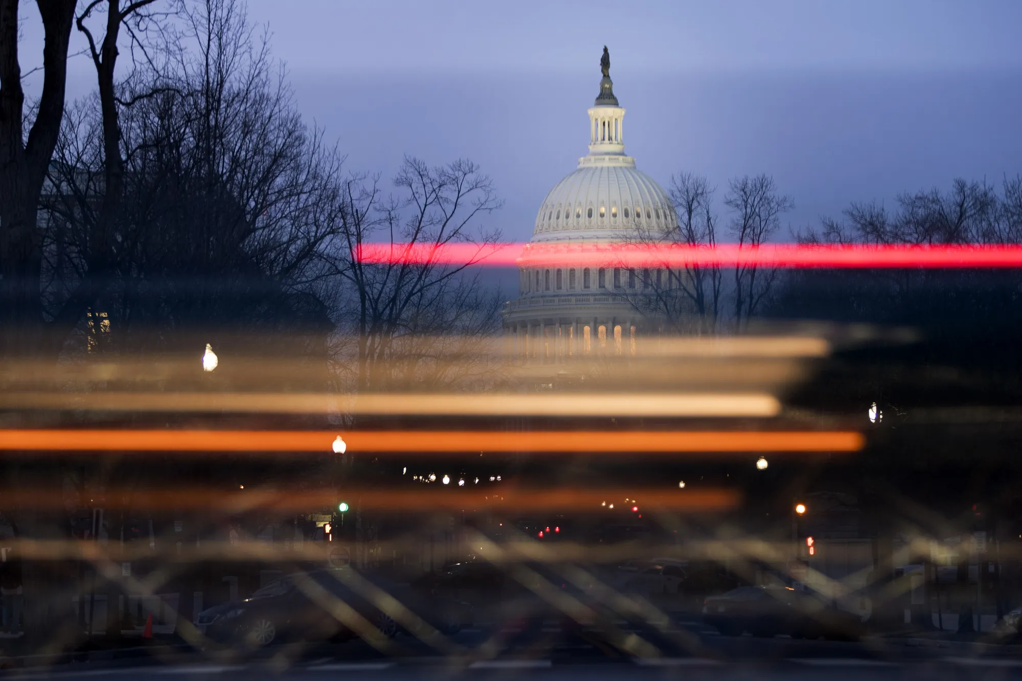 A vehicle passes the U.S. Capitol building in Washington, D.C., U.S., on Friday, March 24, 2017.