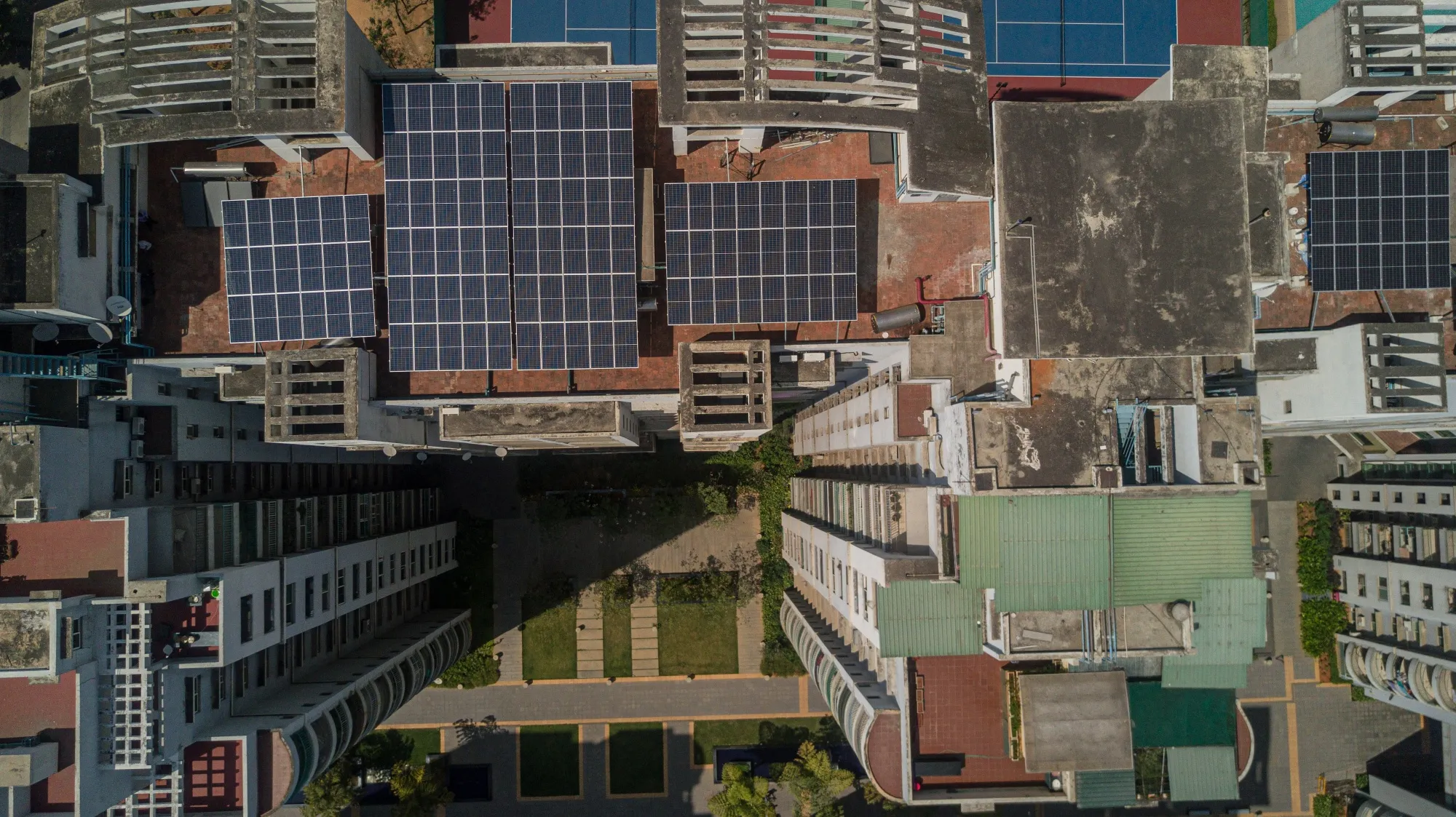 Solar panels on the roof of an apartment block in Bengaluru, India.