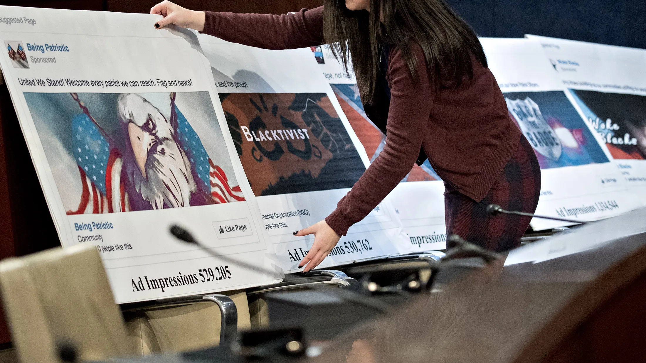 A staff member arranges a display showing a social media post during a House Intelligence Committee hearing in Washington, D.C. on&nbsp;Nov. 1, 2017.&nbsp;