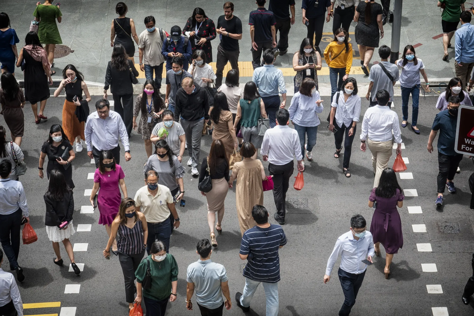 Pedestrians in the central business district in Singapore.