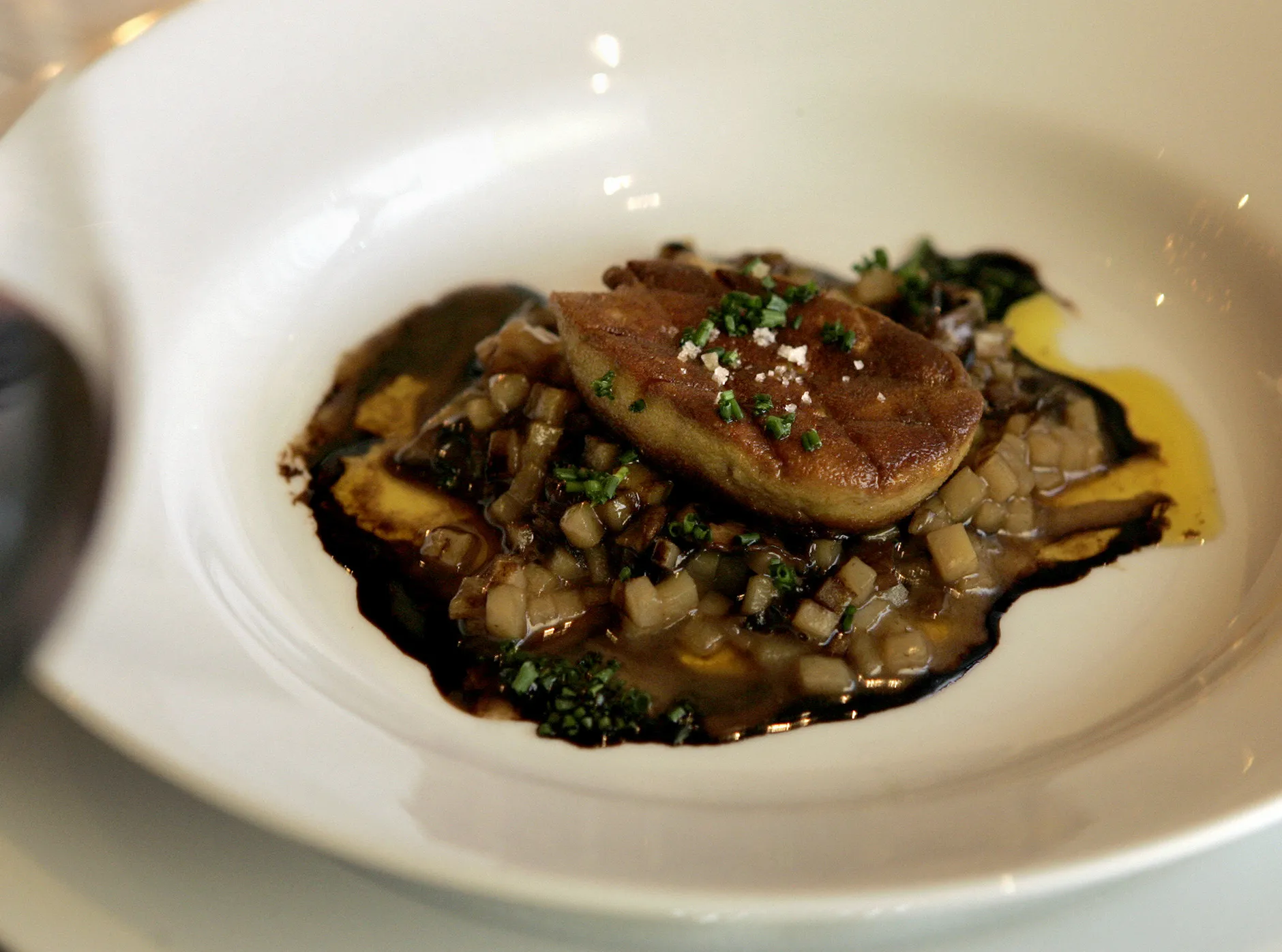 A piece of foie gras on potato risotto in New York.