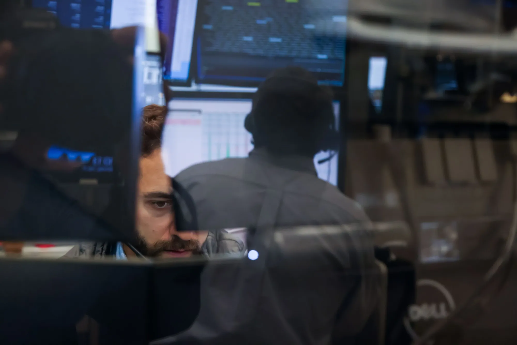 Traders work on the floor of the American Stock Exchange (AMEX) at the New York Stock Exchange (NYSE) in New York.