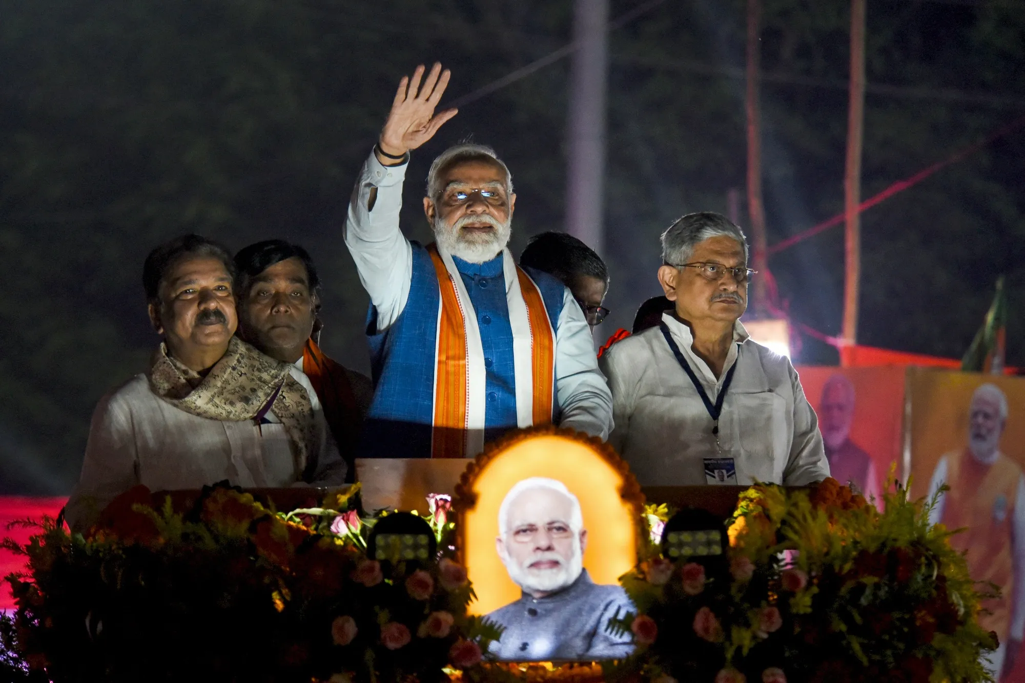 India's Prime Minister Narendra Modi&nbsp;waves to supporters during his roadshow in Patna, ahead of assembly elections in Bihar state on Nov. 2.