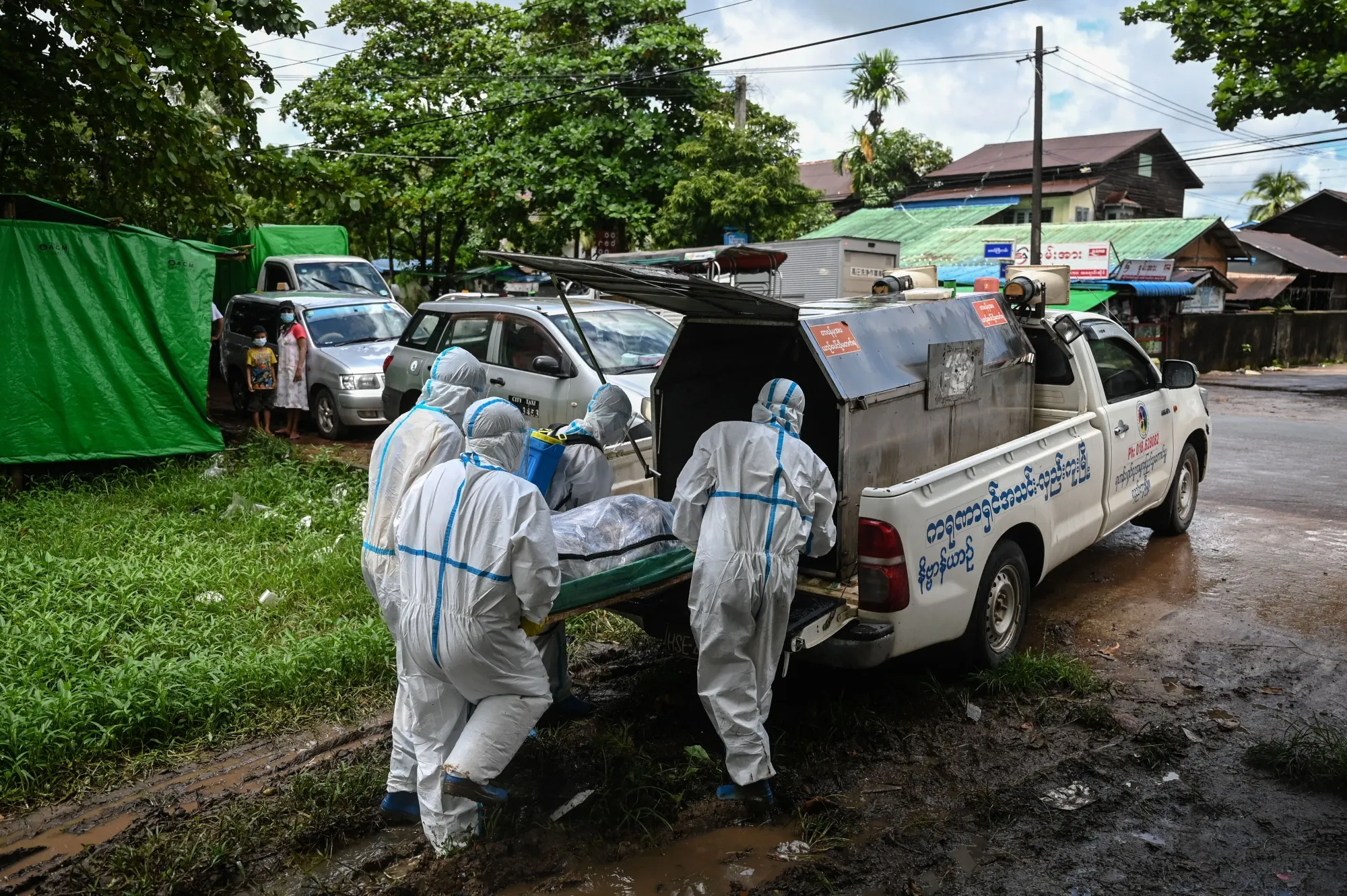 Volunteers prepare to transport&nbsp;the body of a victim of Covid-19&nbsp;to a cemetery in Hlegu Township in Yangon on July 10.