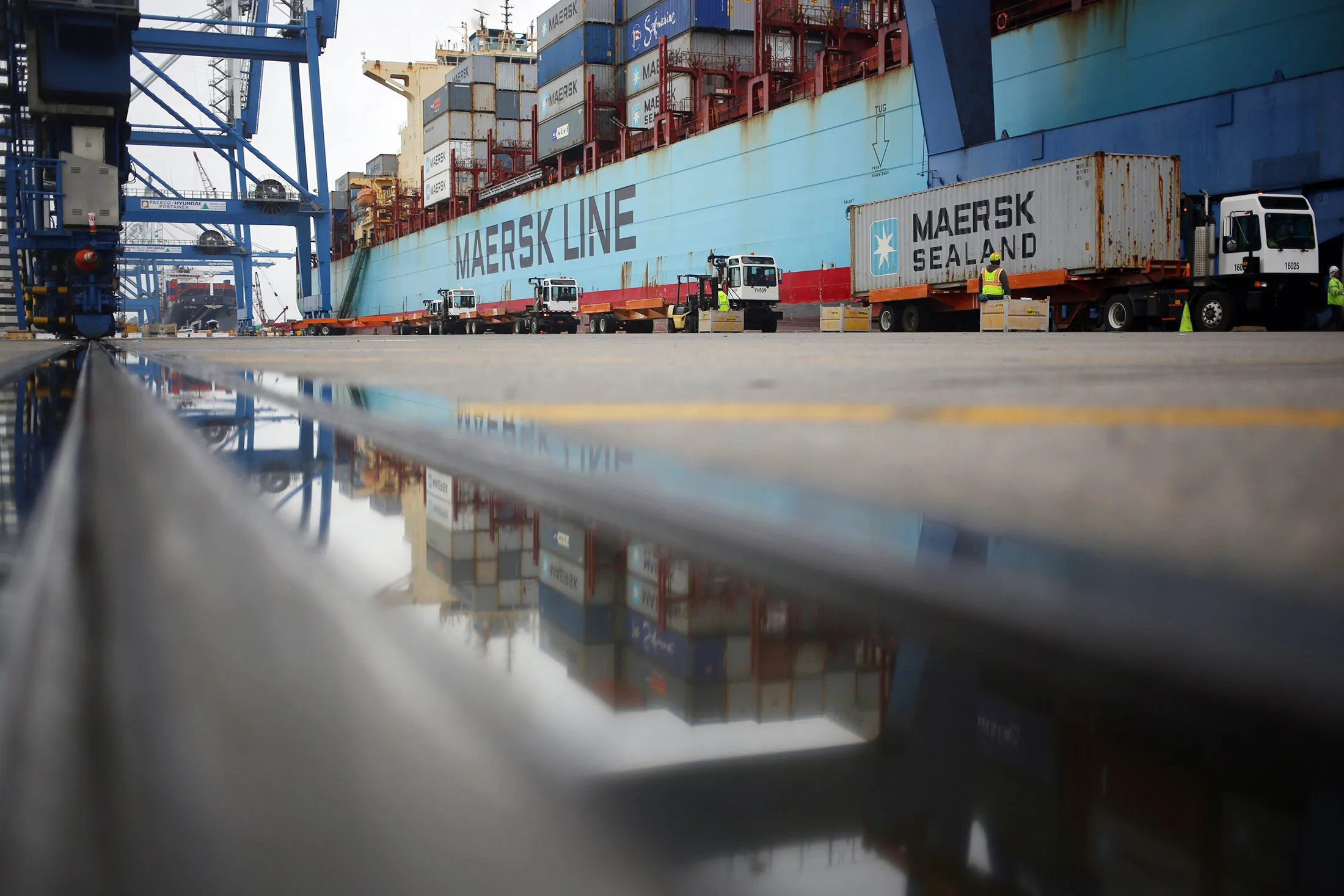 A shipping container is unloaded from the Maersk Hartford cargo ship at the Port of Charleston in Charleston, South Carolina.
