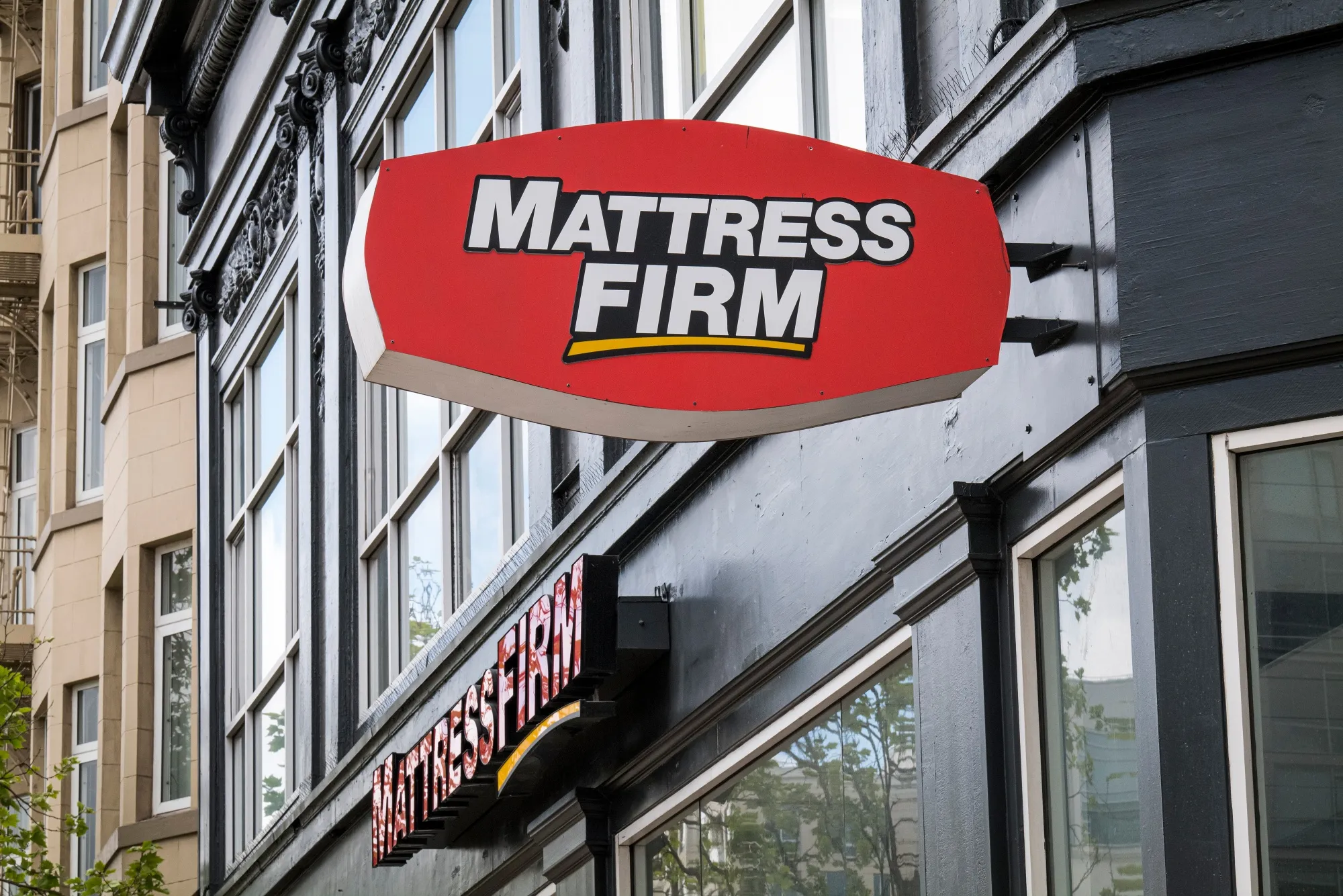 Mattress Firm Holdings Corp. signage is displayed on the front of a store in San Francisco, California, U.S.