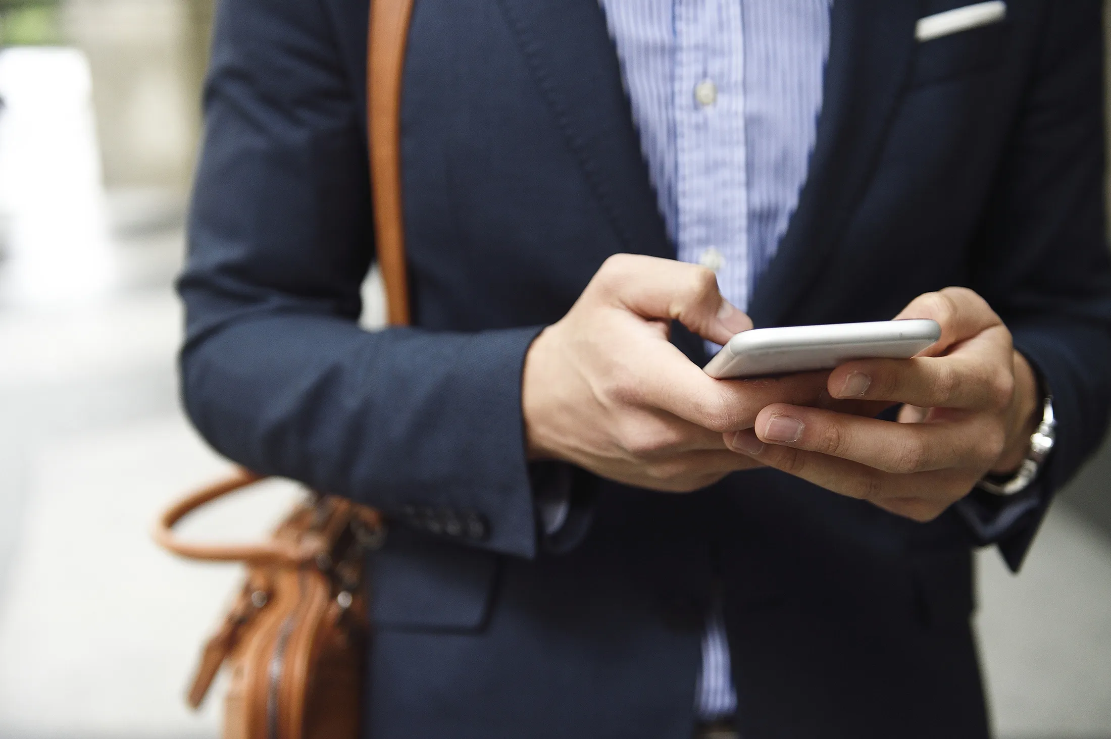 Close up of wealthy man's hands on a smart phone RF