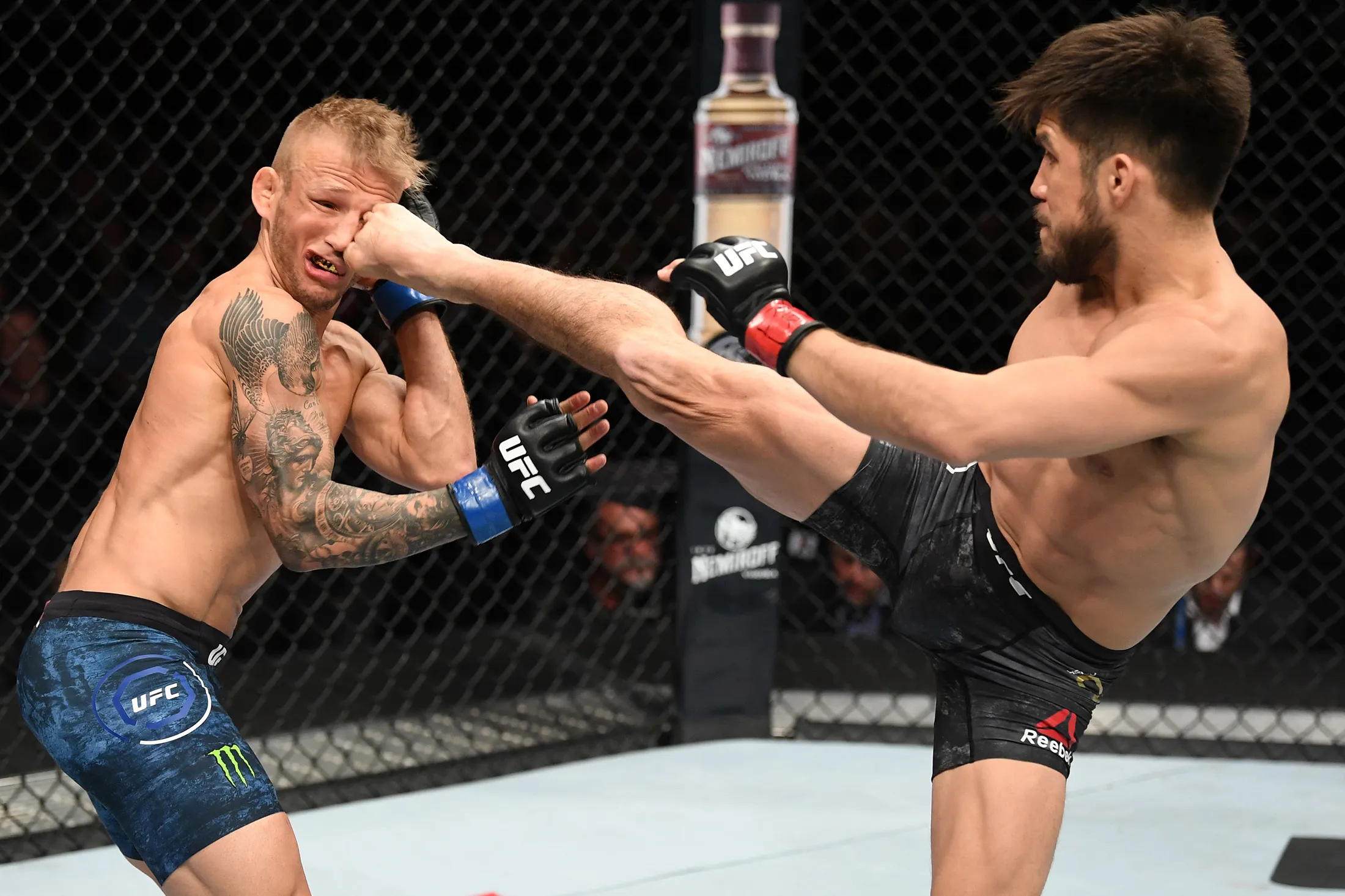 Henry Cejudo kicks TJ Dillashaw during UFC Fight Night on Jan. 19.
