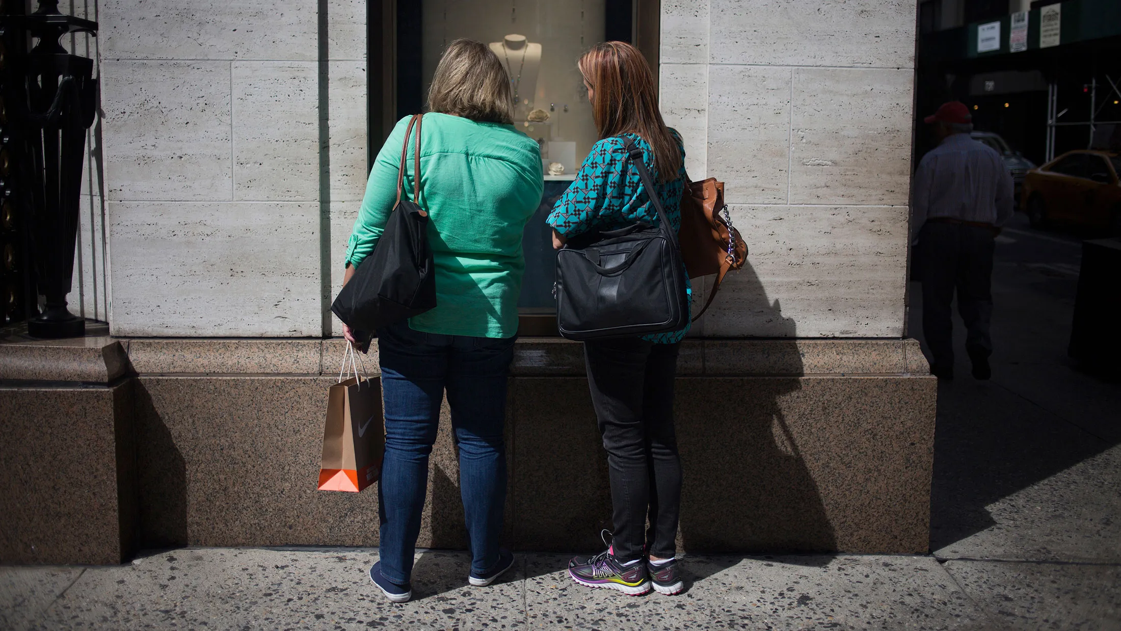 Window shoppers in New York City.
