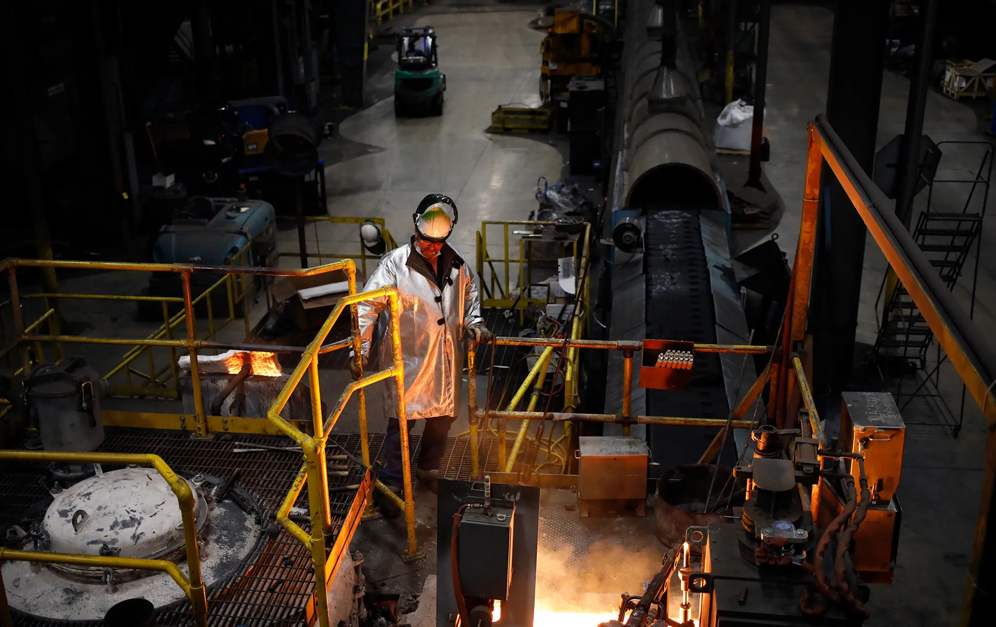 A worker oversee molten iron during cookware production at a factory in South Pittsburg, Tennessee.