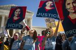 Demonstrators with Students for Life call for the confirmation of Amy Coney Barrett outside the Supreme Court on the third day of her Senate Judiciary Committee confirmation hearing in 2020. 