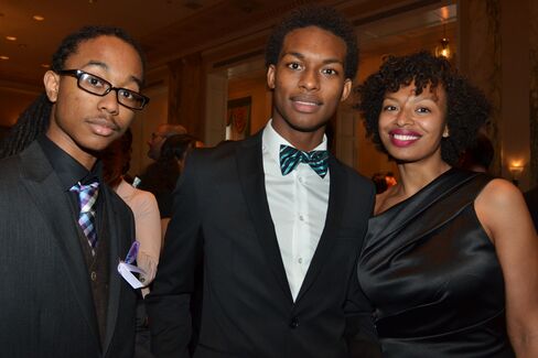 Ian Effendi and Dion Aljure, seniors at Bronx High School of Science, and Nigeria Aljure, an attorney for New York City. Photographer: Amanda Gordon/Bloomberg