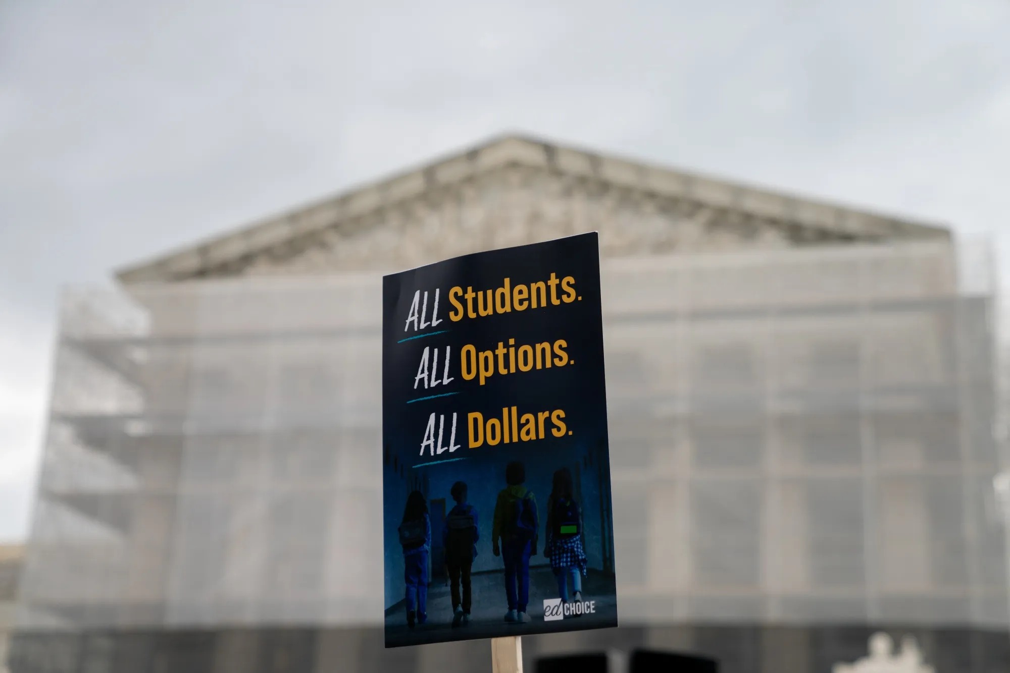 A demonstrator holds a sign in front of the Supreme Court in Washington&nbsp;on&nbsp;April 30.