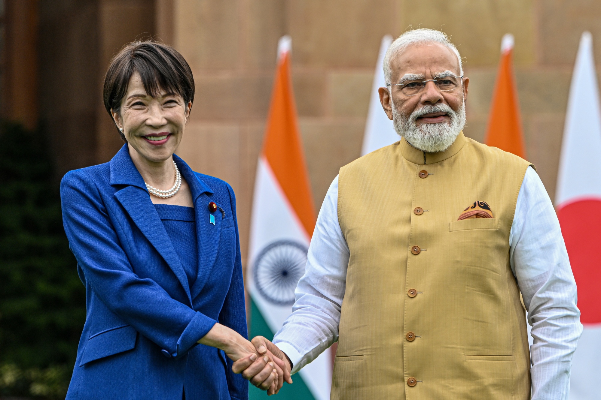 Sanae Takaichi, Japan's prime minister, left, shakes hands with Narendra Modi, India's prime minister, at Hyderabad House in New Delhi, India, on Thursday, July 2, 2026. Takaichi met with Modi in New Delhi on Thursday during her first official visit to the country, as the two sides seek to deepen strategic and economic ties. Photographer: Prakash Singh/Bloomberg