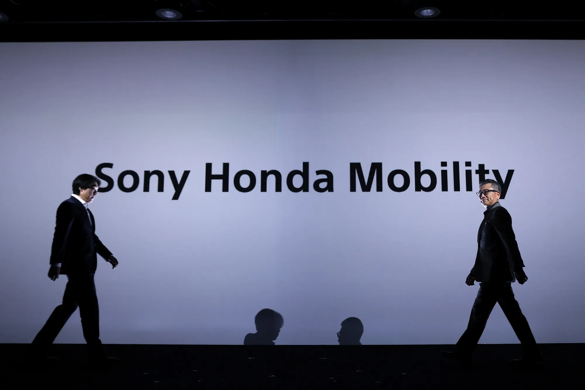 Sony Honda Mobility executives Yasuhide Mizuno and Izumi Kawanishi on the stage.