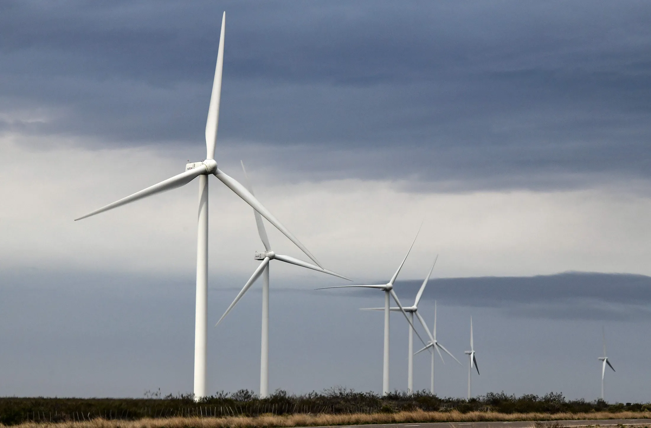 Clouds pass above a wind farm near Diadema, Argentina.