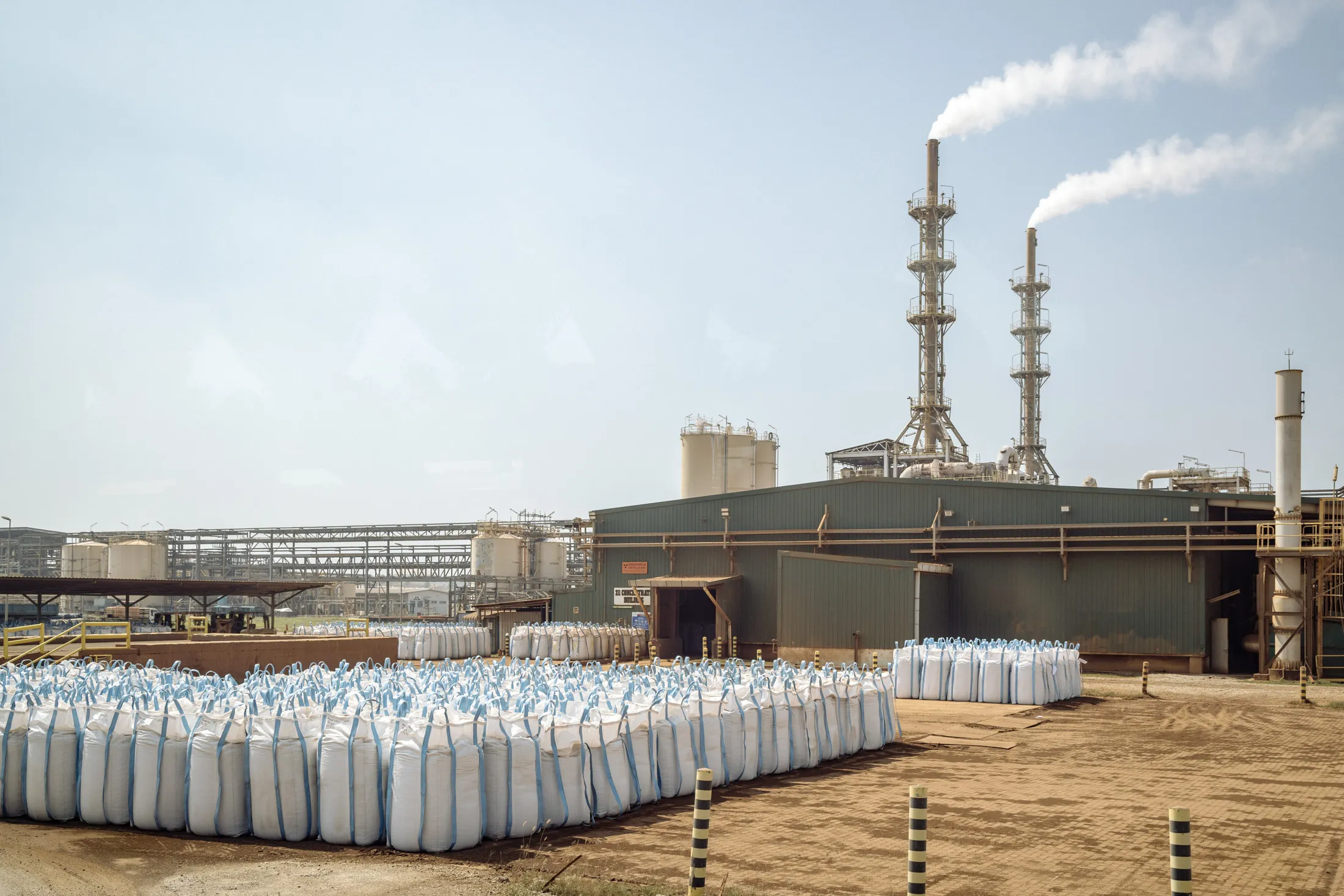 Large white industrial sacks of rare earth ore from Australia are lined up outside the Lynas Advanced Materials Plant in Kuantan, Malaysia.