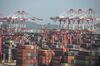 Containers sit stacked among gantry cranes at the Yangshan Deep Water Port in Shanghai, China, on Tuesday, July 10, 2018. China told companies to boost imports of goods from soybeans to seafood and automobiles from countries other than the U.S. after trade tensions between the world's two biggest economies escalated into a tariff war last week.