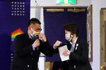 Tokyo 2020 Organising Committee President Seiko Hashimoto (R) and Gon Matsunaka, head of Pride House Tokyo Legacy, greet each another at Pride House Tokyo Legacy in Tokyo on April 27, 2021. 