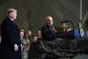 Ashraf Ghani speaks to the troops as Donald Trump listens at Bagram Air Field on Nov. 28.
