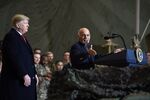 Ashraf Ghani speaks to the troops as Donald Trump listens at Bagram Air Field on Nov. 28.