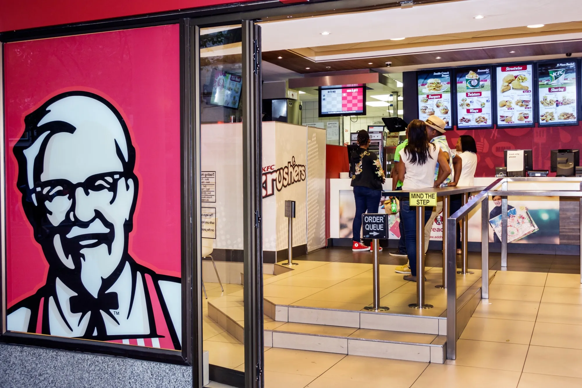 Customers order at a KFC outlet&nbsp;in Cape Town, South Africa.