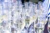 Close-up iced champagne or sparkling wine in glass flutes on a table in a restaurant ready for an extravaganza, celebration or a party