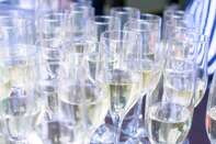 Close-up iced champagne or sparkling wine in glass flutes on a table in a restaurant ready for an extravaganza, celebration or a party
