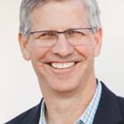 Headshot of Michael G Combs